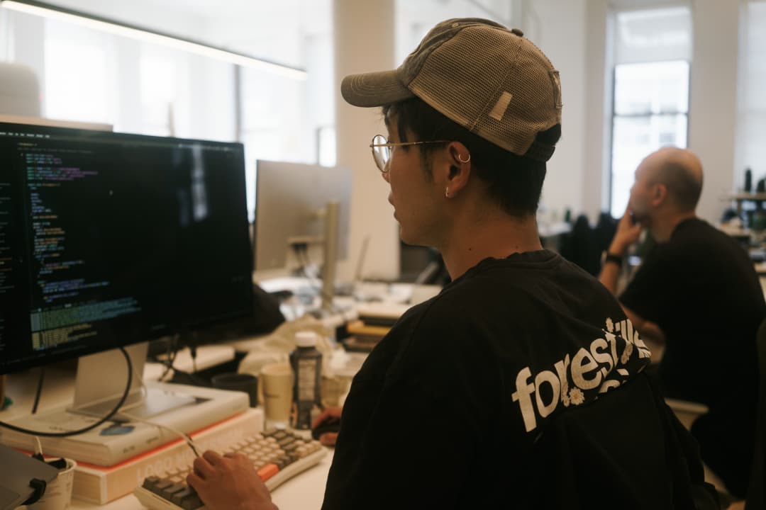 Chang and Xiulung cooking at the office